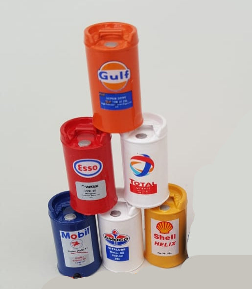 Collection of miniature oil cans with various brand logos