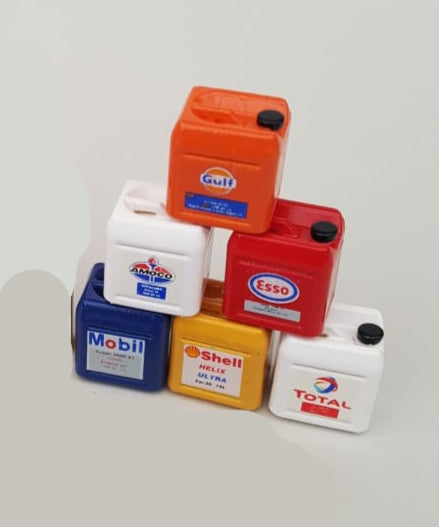 Collection of miniature oil cans with various brand logos